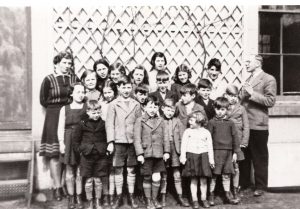 Alderney evacuees with their Headmaster, Mr Godfray, Cheshire,1940