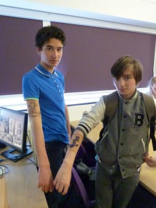 Two participants modelling their sailor tattoos