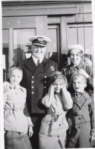 Captain James Bridson pictured with four evacuees on board the SS Viking, June 1940