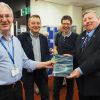 Portsdown U3A's Steve Doe presents their publication of findings to Portsmouth City Councillor Frank Jonas. With Professor Brad Beaven and Dr Rob James.